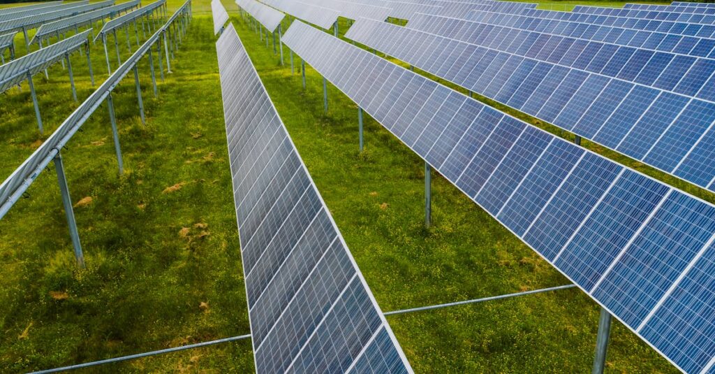 Aerial view of solar panels in a green field, Rossville, GA.