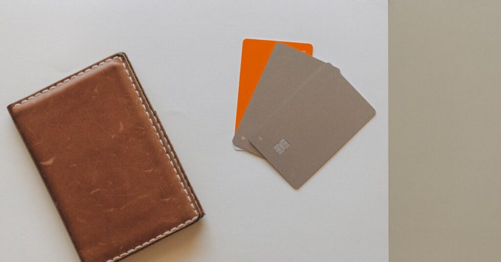 A leather wallet and credit cards on a minimalist background, ideal for financial themes.